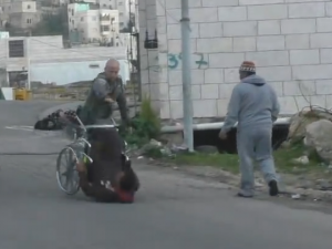 Israeli_Police_Officer_Dumps_Over_Man_In_Wheelchair_2_15_16